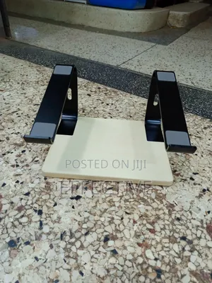 Portable Laptop Stand With a Wooden Base and Black Metal Frame.