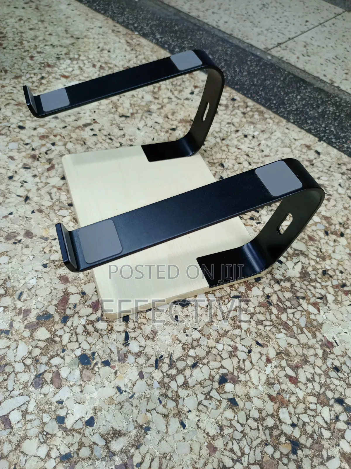 Portable Laptop Stand With a Wooden Base and Black Metal Frame.