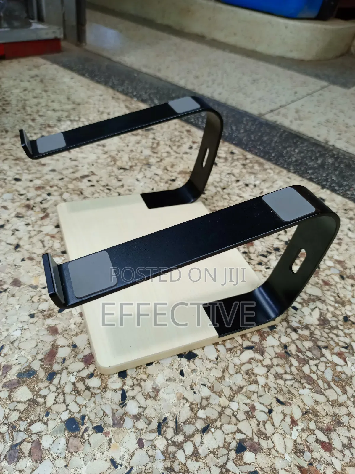 Portable Laptop Stand With a Wooden Base and Black Metal Frame.