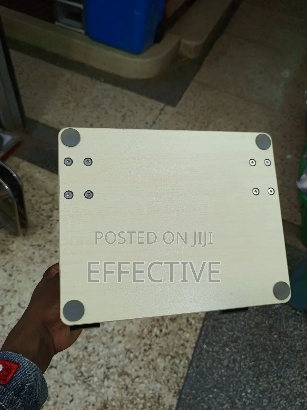 Portable Laptop Stand With a Wooden Base and Black Metal Frame.