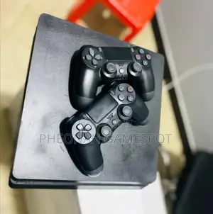 Playstation 4 Slim, 2 Controllers, 12 Games, Clean, 6 Months Warranty.
