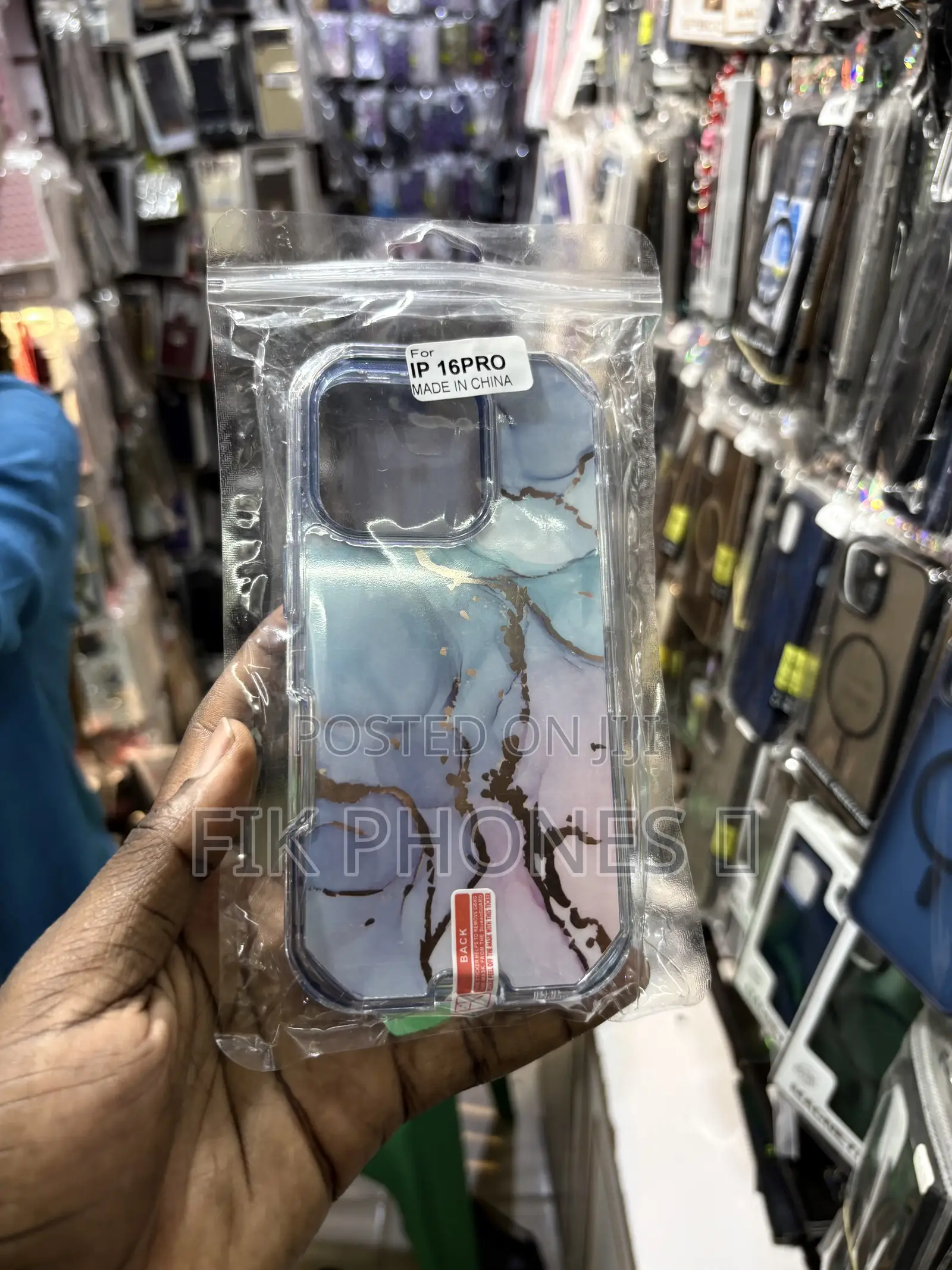 A Clear Protective Phone Case With a Blue, Pink, and Gold Marble Desi
