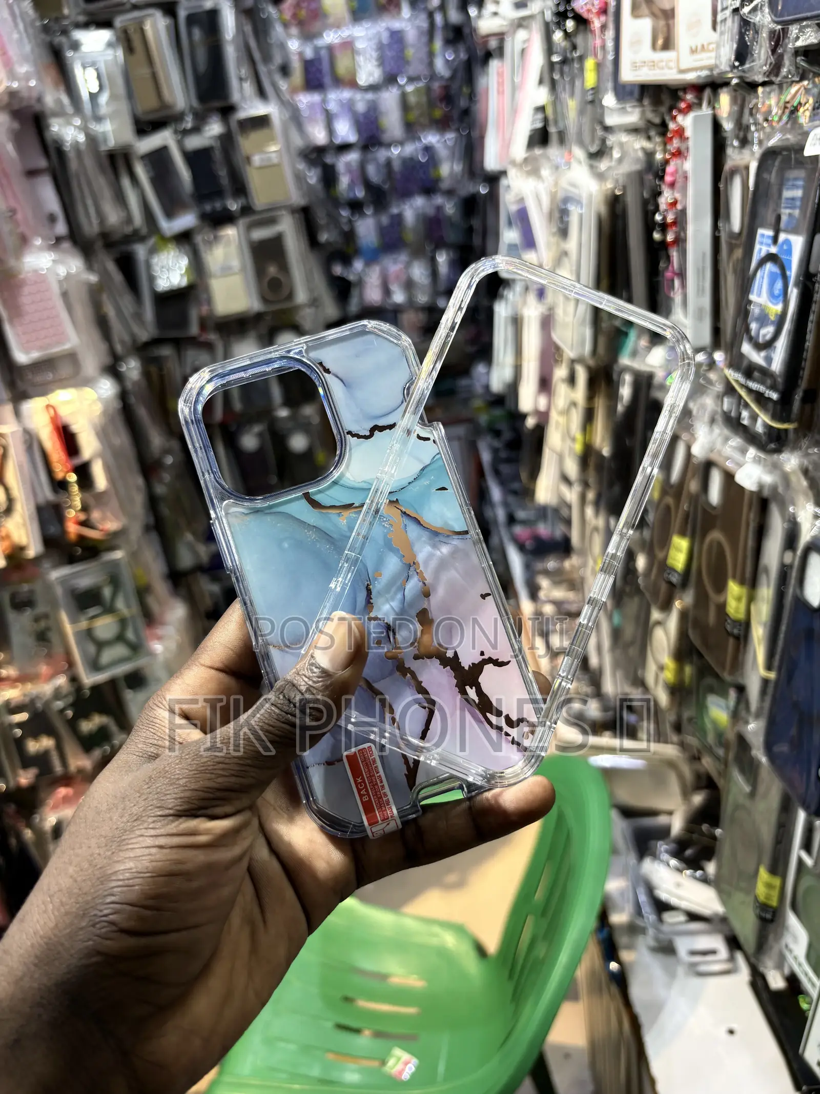 A Clear Protective Phone Case With a Blue, Pink, and Gold Marble Desi