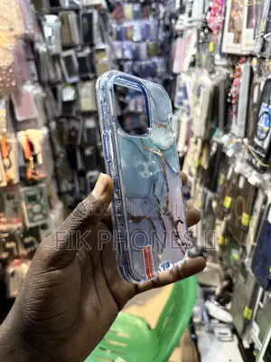 A Clear Protective Phone Case With a Blue, Pink, and Gold Marble Desi