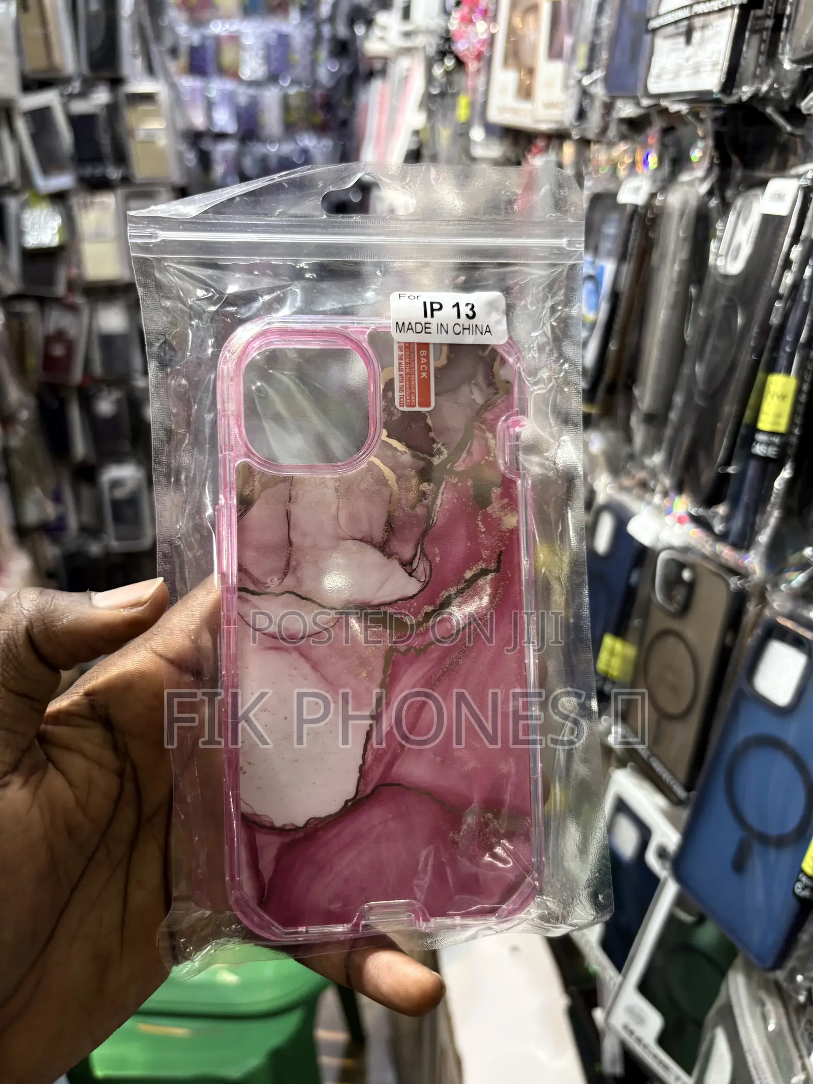 A Clear Protective Phone Case With a Blue, Pink, and Gold Marble Desi