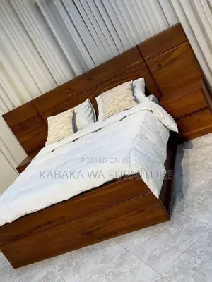 This a 5by6 /Bed in Gray Its Made /of Har Wood /and Quality Foam/