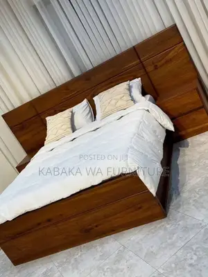 This a 5by6 /Bed in Gray Its Made /of Har Wood /and Quality Foam/