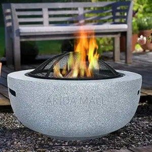 Round Outdoor Fire Pit With a Speckled Artificial Stone Surround