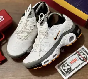 Nike Air Max Plus (Tn) Sneakers In A White,Grey,And Orange Colorways
