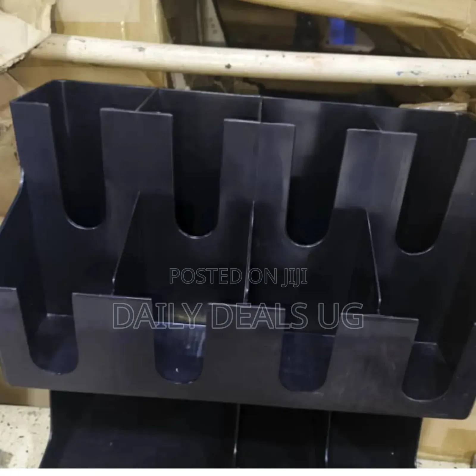 A Black Plastic Coffee Cup and Lid Organizers