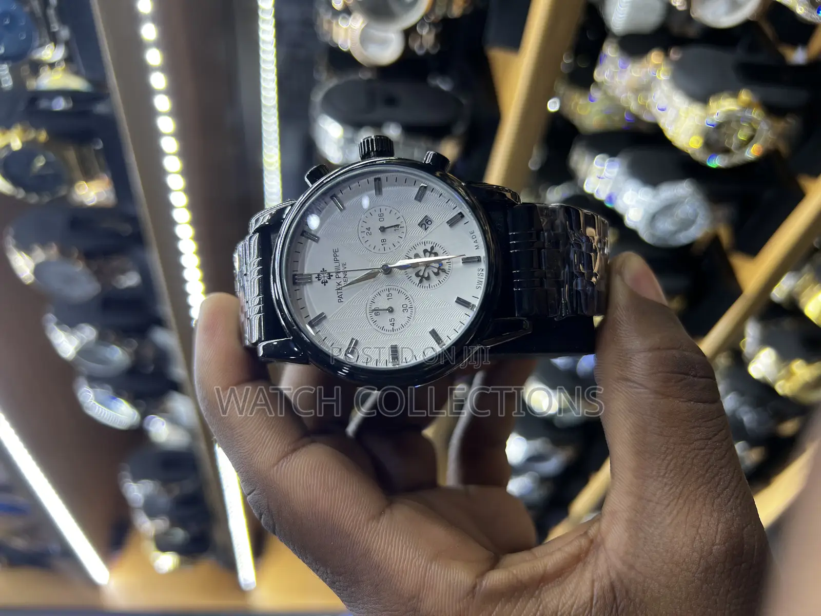 Black Mens Patek Phillipe Watch With a White Dail