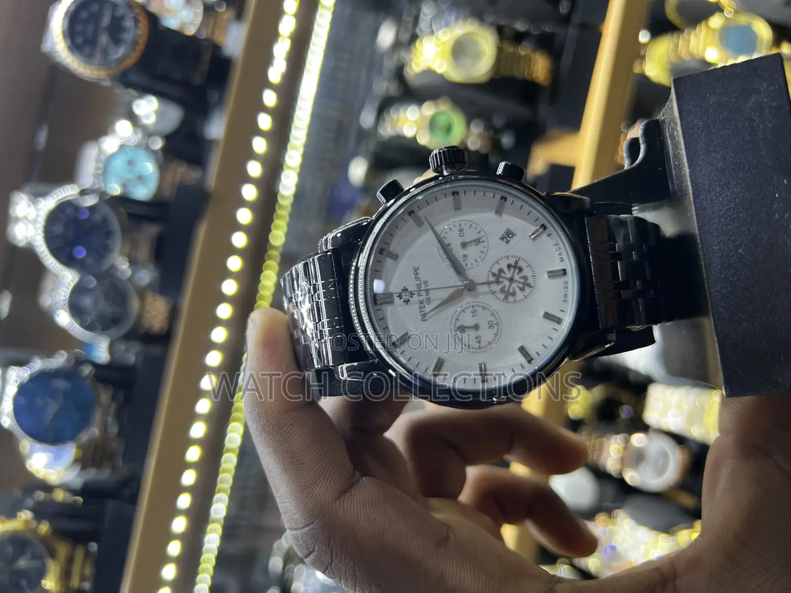Black Mens Patek Phillipe Watch With a White Dail