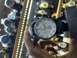 Black Mens Patek Phillipe Watch With a White Dail