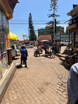 100*100feet Plot of Land With Shops in Ntinda on Main Tarmac Road