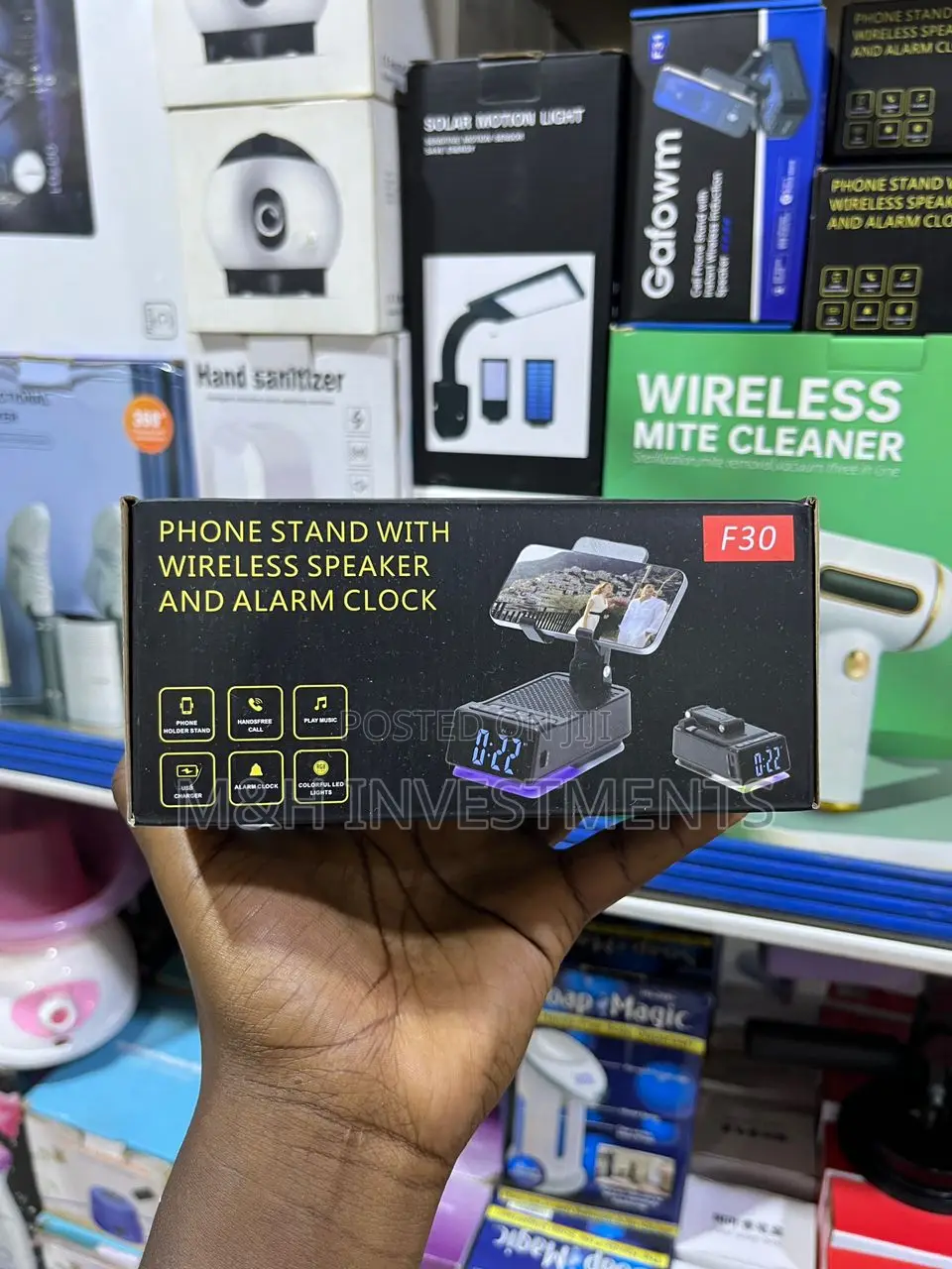 A Phone Stand With Wireless Speakers and Alarm Clock