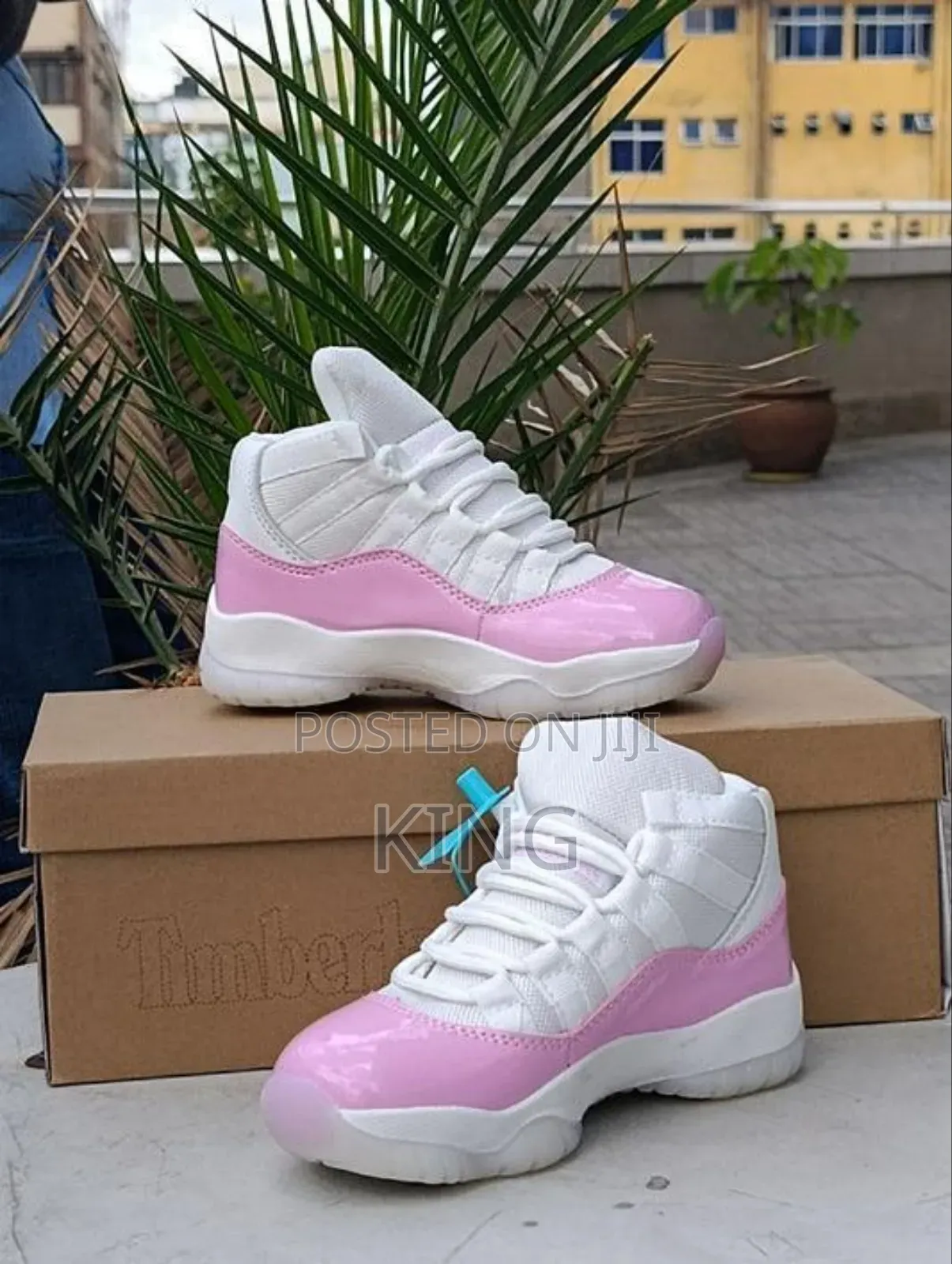 Nike Air Jordan 11 Sneaker in a White and Pink Colorway.
