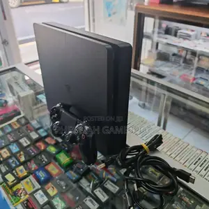 Playstation 4 Slim (500gb) - Ready to Play. 12 Games and 2 Controllers