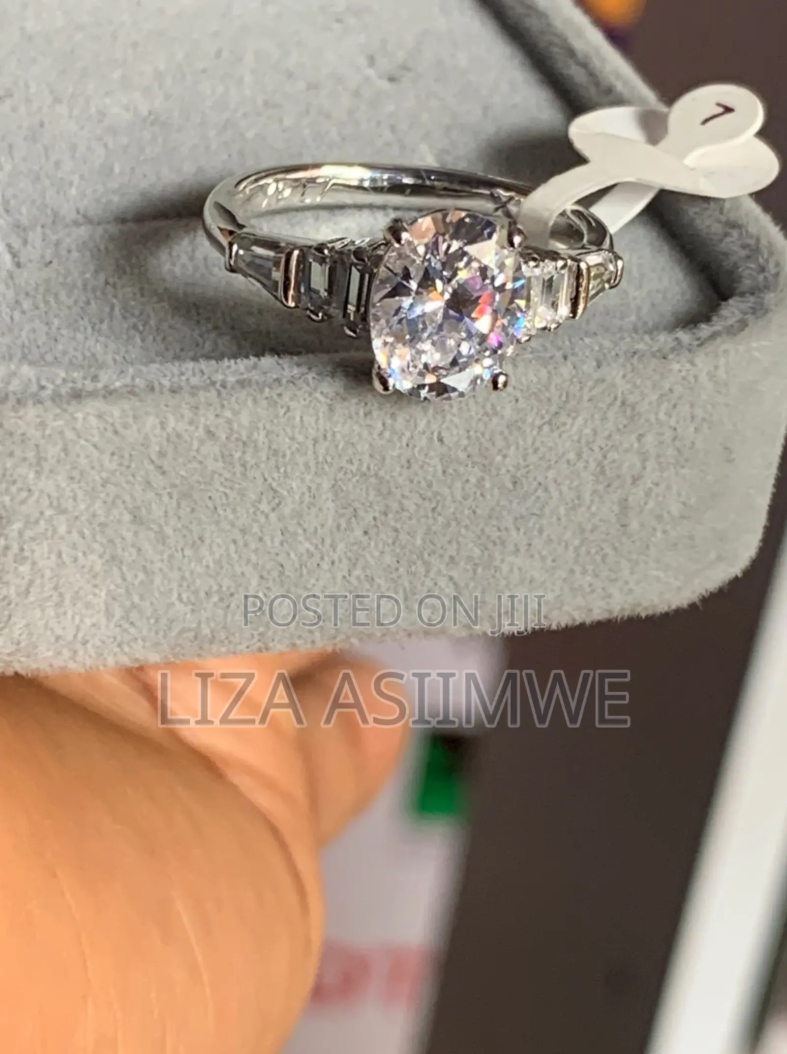 Oval-Cut Solitaire Engagement Ring With Baguette Side Stones
