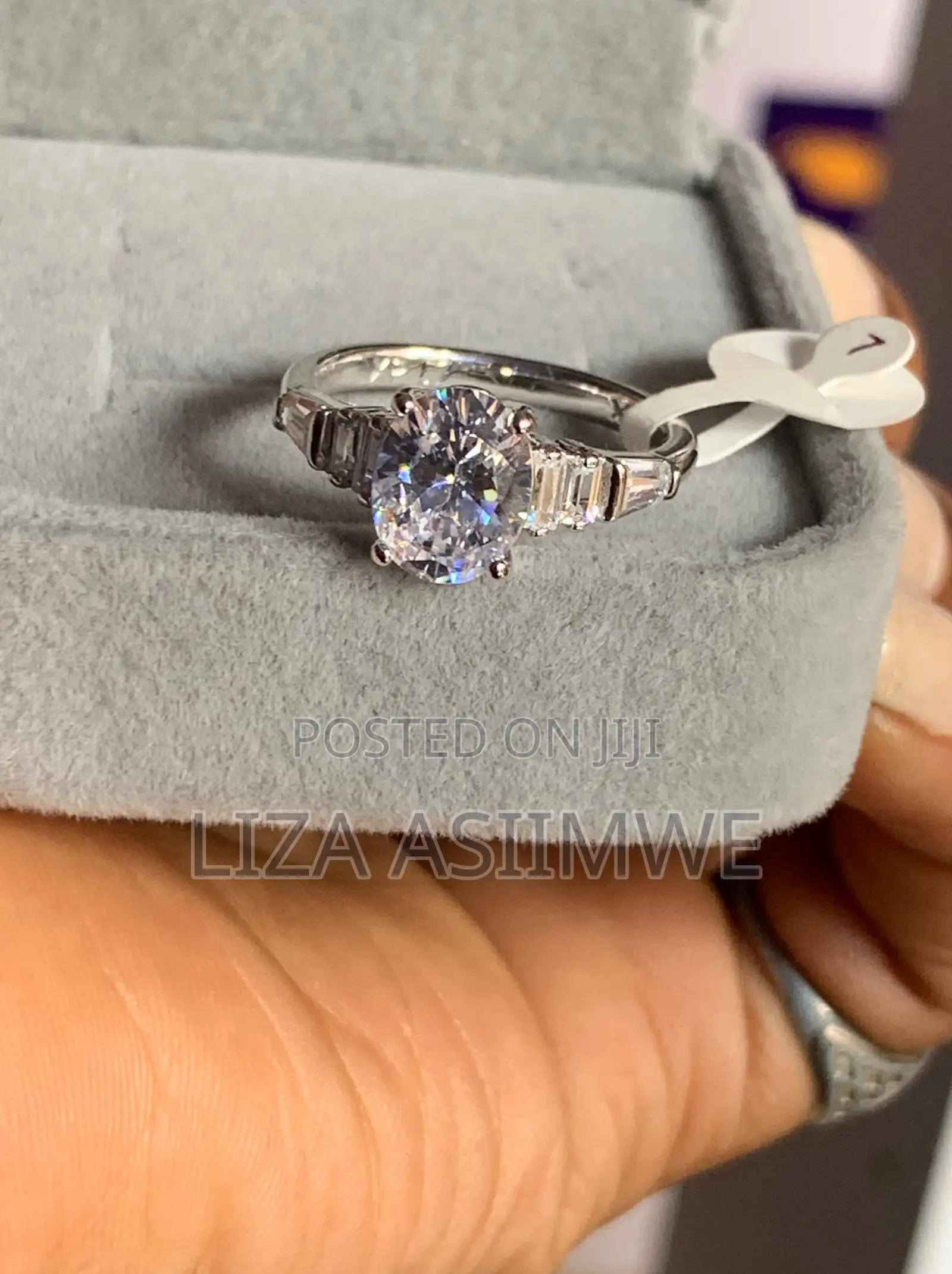 Oval-Cut Solitaire Engagement Ring With Baguette Side Stones