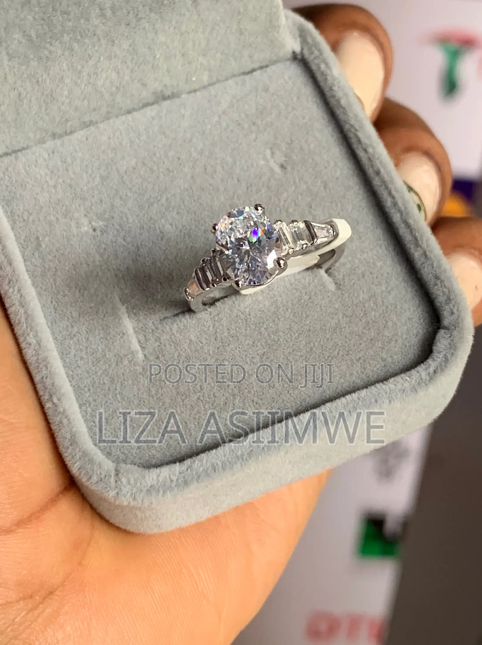 Oval-Cut Solitaire Engagement Ring With Baguette Side Stones