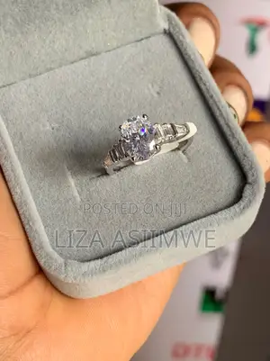 Oval-Cut Solitaire Engagement Ring With Baguette Side Stones