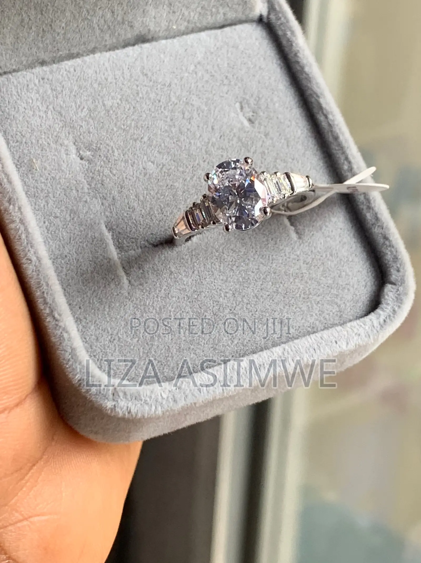 Oval-Cut Solitaire Engagement Ring With Baguette Side Stones