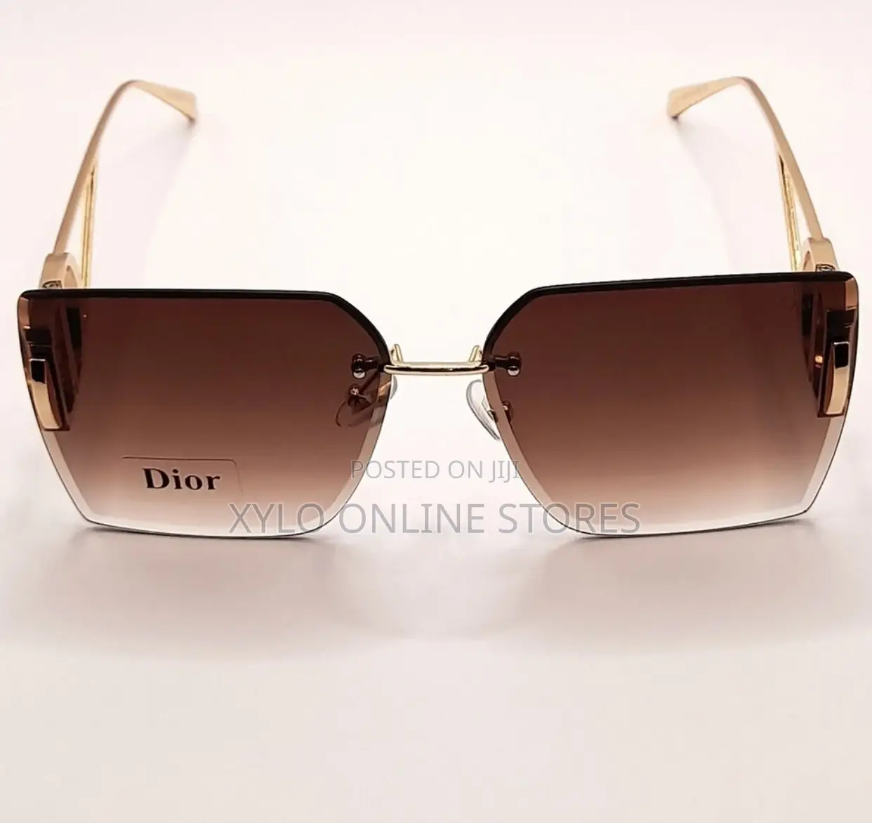 A Pair of Dior Sunglasses With Brown Gradient Lenses