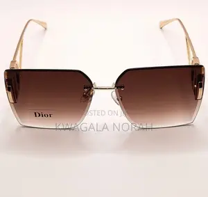 A Pair of Dior Sunglasses With Brown Gradient Lenses
