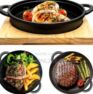 Cast Iron Sizzler Pan With A Wooden Serving Board.