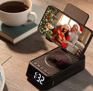 Phone Stand With Wireless Speaker And Alarm Clock.