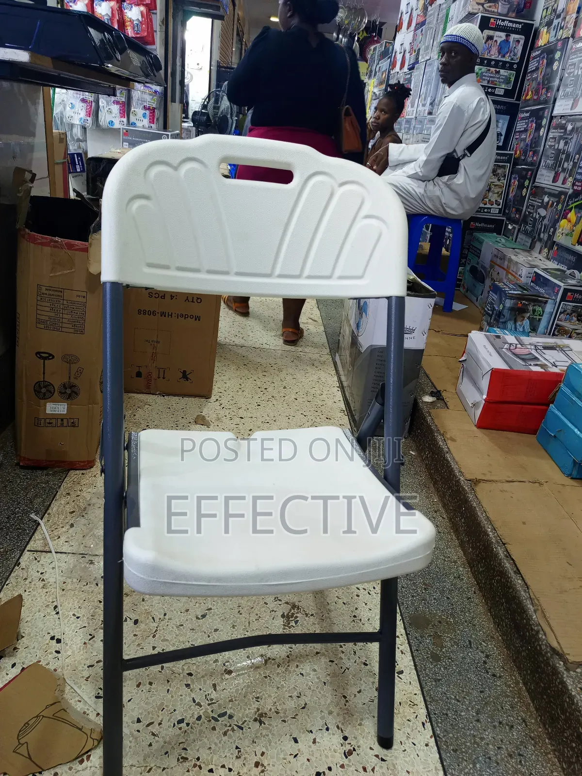 Plastic Folding Chair With a Grey Metal Frame.