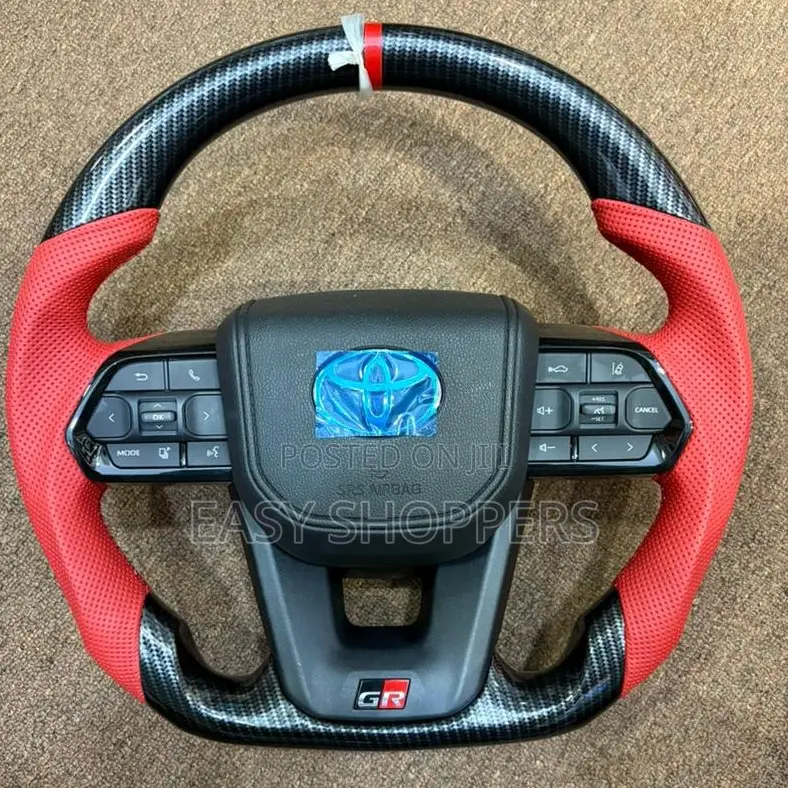 Toyota (Gr) Steering Wheel With Red Leather and Carbon Fiber Wrapping.