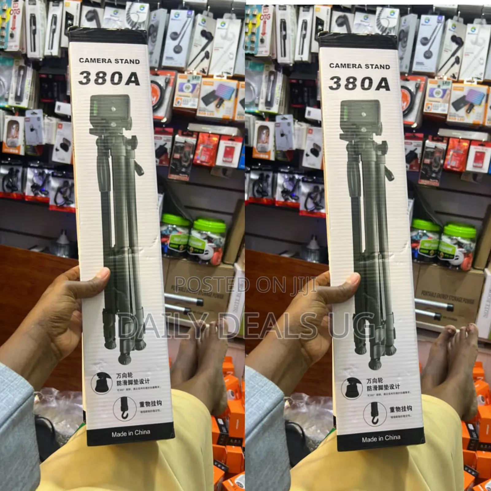 A Box for a 380a Camera and Mobile Phone Tripod Stand