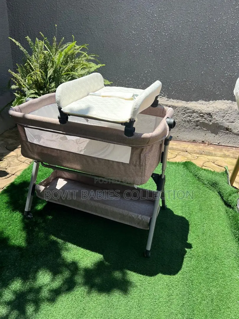Multifunction Bedside Baby Crib Bed With a Diaper Changer.