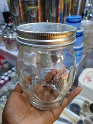 Clear Glass Storage Jar With a Metal Screw-on Lid.