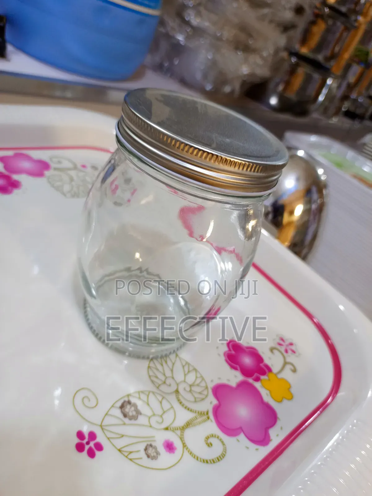 Clear Glass Storage Jar With a Metal Screw-on Lid.