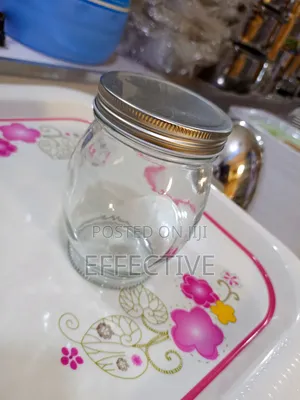 Clear Glass Storage Jar With a Metal Screw-on Lid.