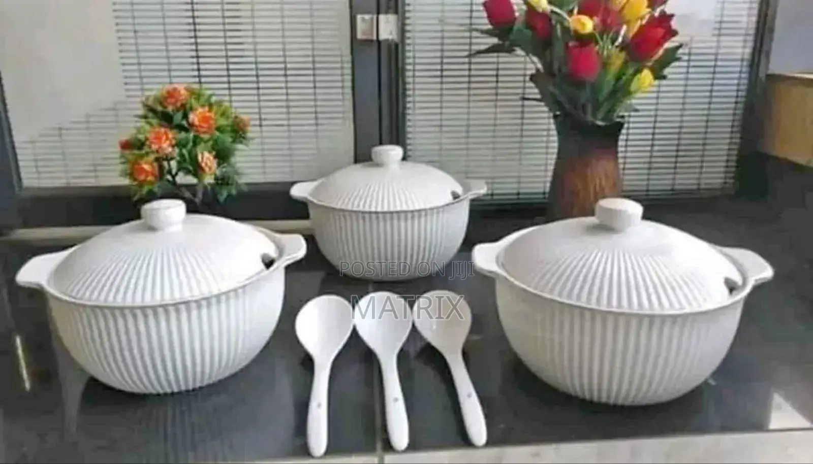 A Set of White Fluted Ceramic Serving Dishes