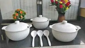 A Set of White Fluted Ceramic Serving Dishes