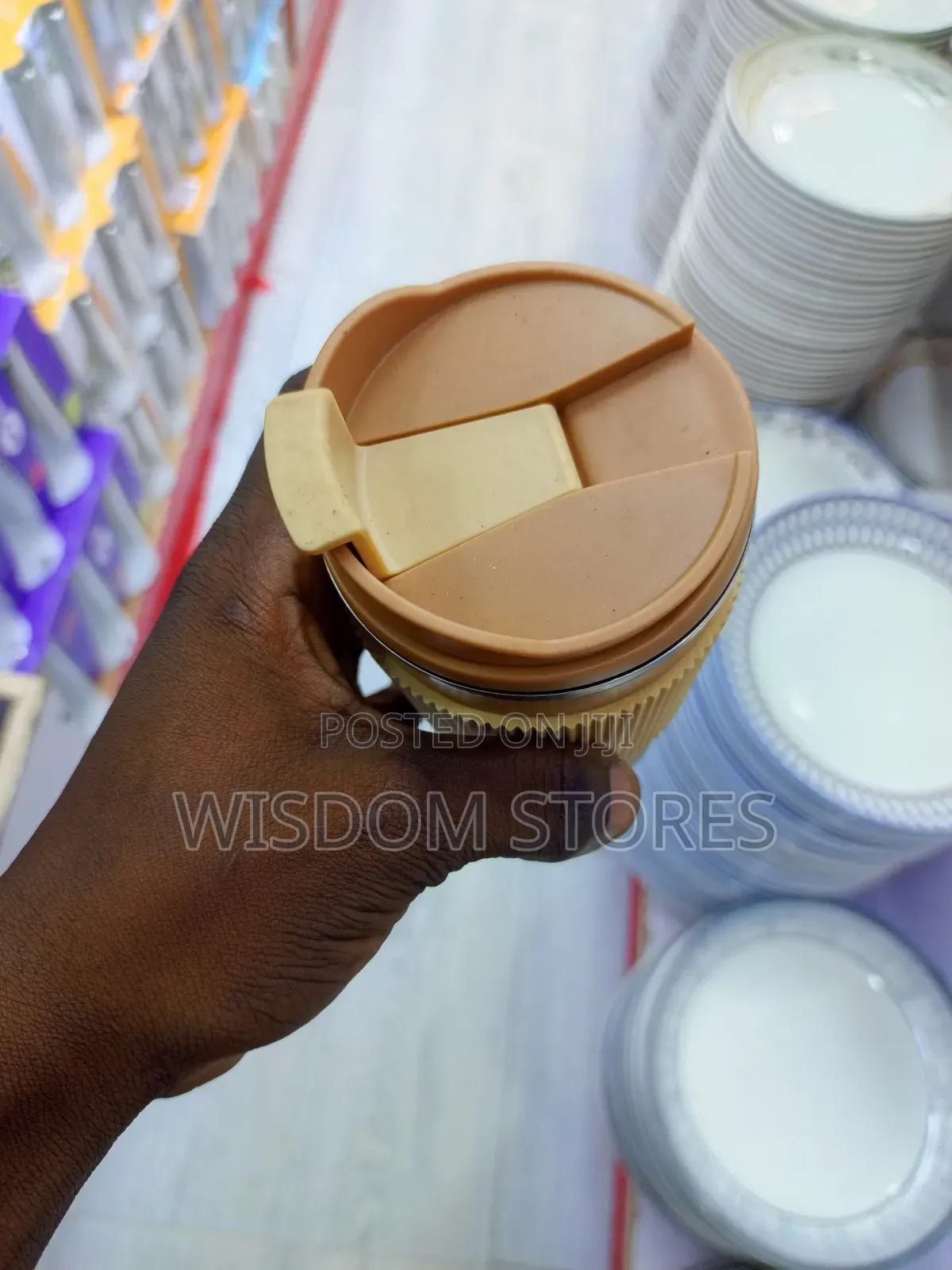 Insulated Travel Coffee Mug With a Lid and a Silicone Grip Sleeve.