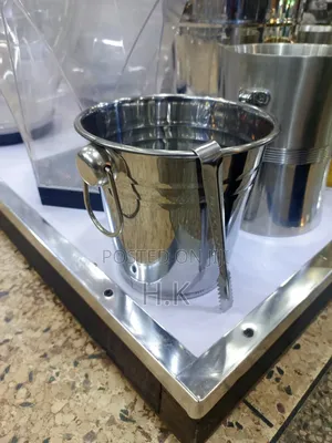 Stainless Steel Ice Bucket With Accompanying Tongs.