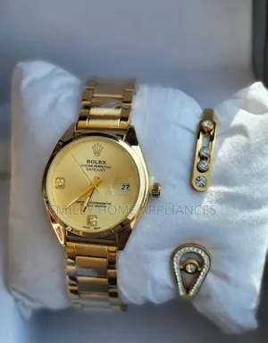 Golden Strapped Women's Analog Rolex Wrist Time Piece With a Bracelet