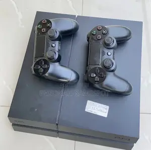 Ps4 Family Gaming System With 2 Controllers and 14 Games Loaded.