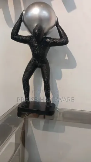 Man Carrying Globe Black