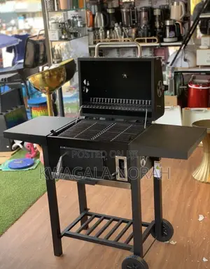 A Heavy Duty Charcoal Cooking Grill Black