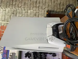 Ps5 Console Setup: 2 Controllers, 3 Games, Ready for Play