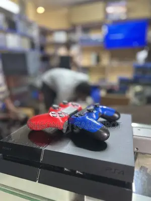 Ps4 Clean Reliable Console With 2 Controllers and 14 Games Inside.