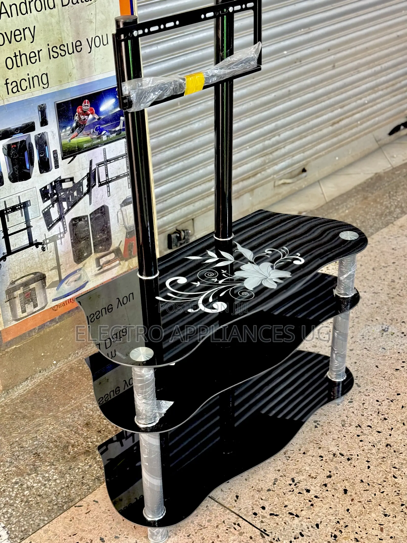 Glass Tv Stand With a Built-in Tv Mount Bracket.