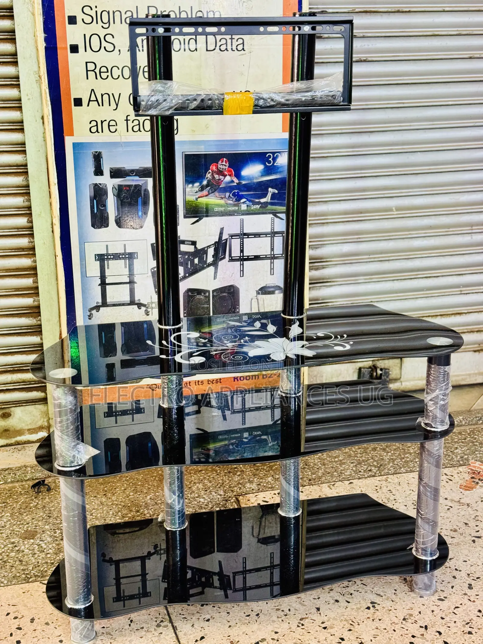 Glass Tv Stand With a Built-in Tv Mount Bracket.