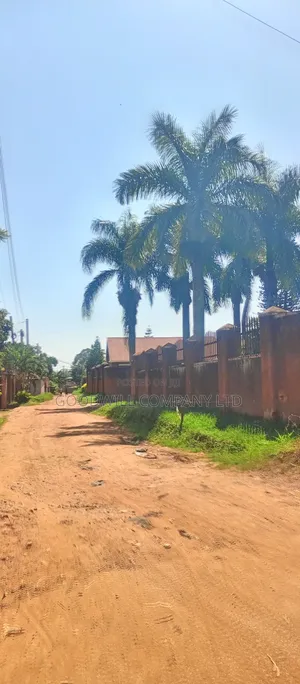 1 Acre of Land in Namugongo (W/T Old Fashioned House 6units Rentals